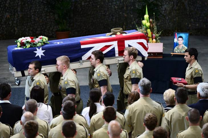Australian soldiers carrying the coffin of one of their own. Australian soldiers carrying the coffin of one of their own.